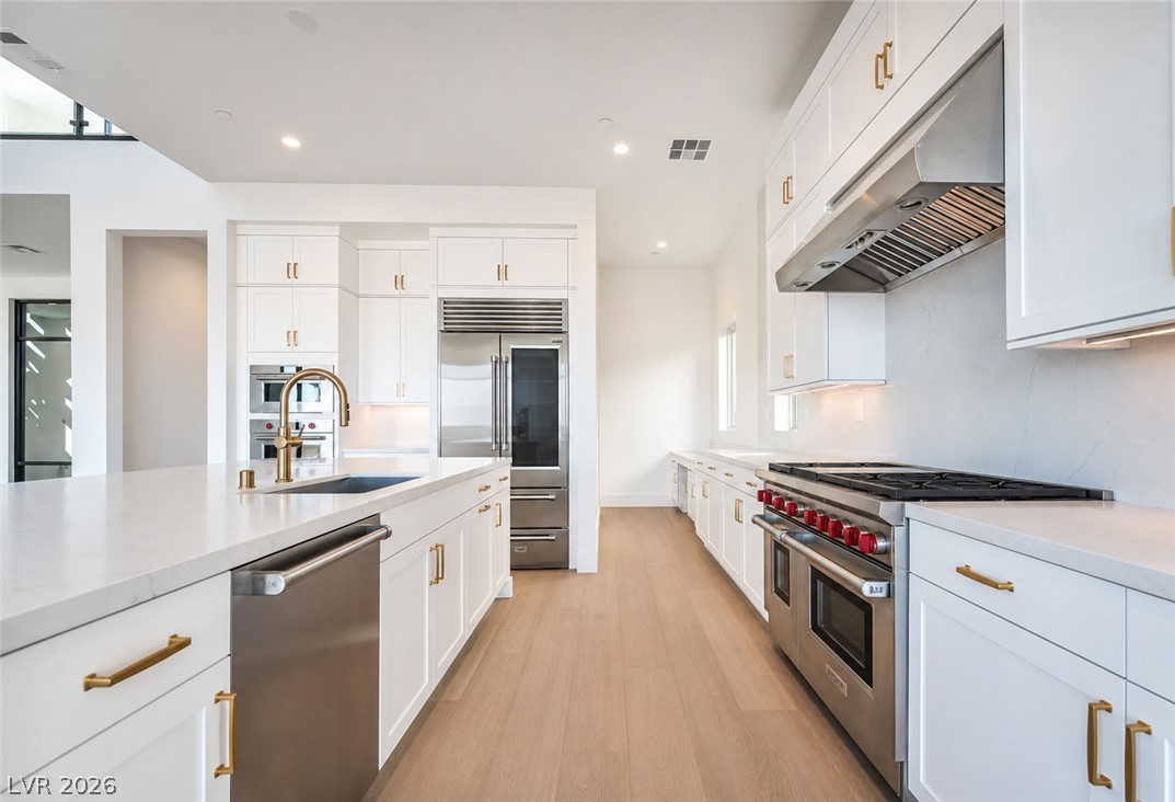 4846 Shady Rdg Drive Las Vegas, NV 89135 - Photo 5 of 60 Culinary excellence awaits in this modern kitchen with extensive counter space and top-tier appliances.