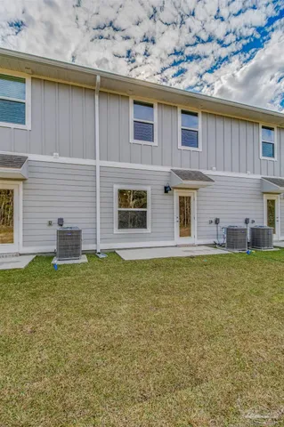 a backyard of a house with lots of green space