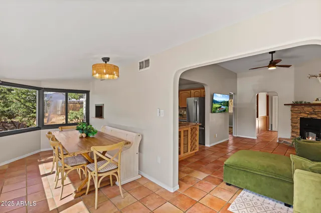 a view of a livingroom with furniture and a fireplace
