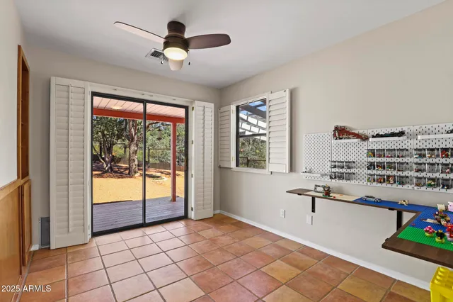 a very nice looking room with a large window and chandelier