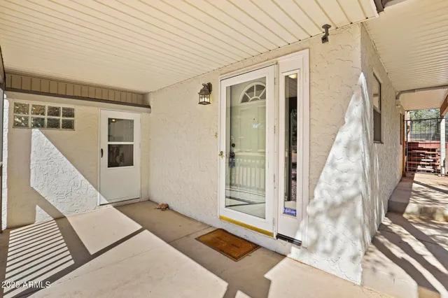 a front view of a house with stairs