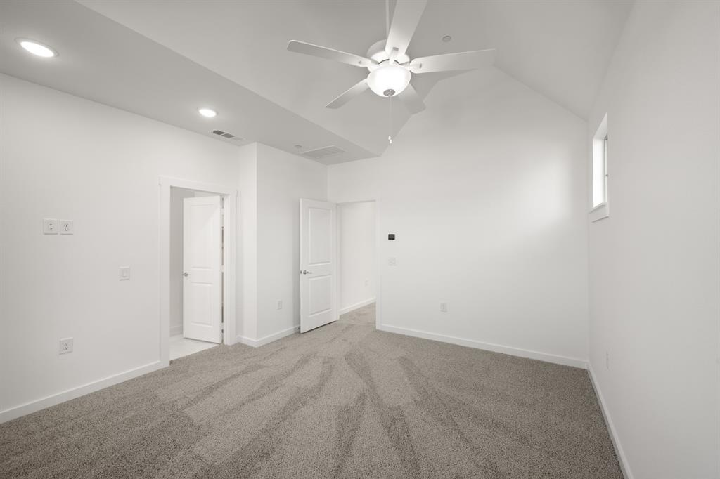 4619 Hawks Trail Oak Point, TX 75068 - Photo 27 of 40 an empty room with a ceiling fan and a window
