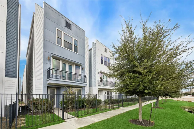 a view of a building with a yard