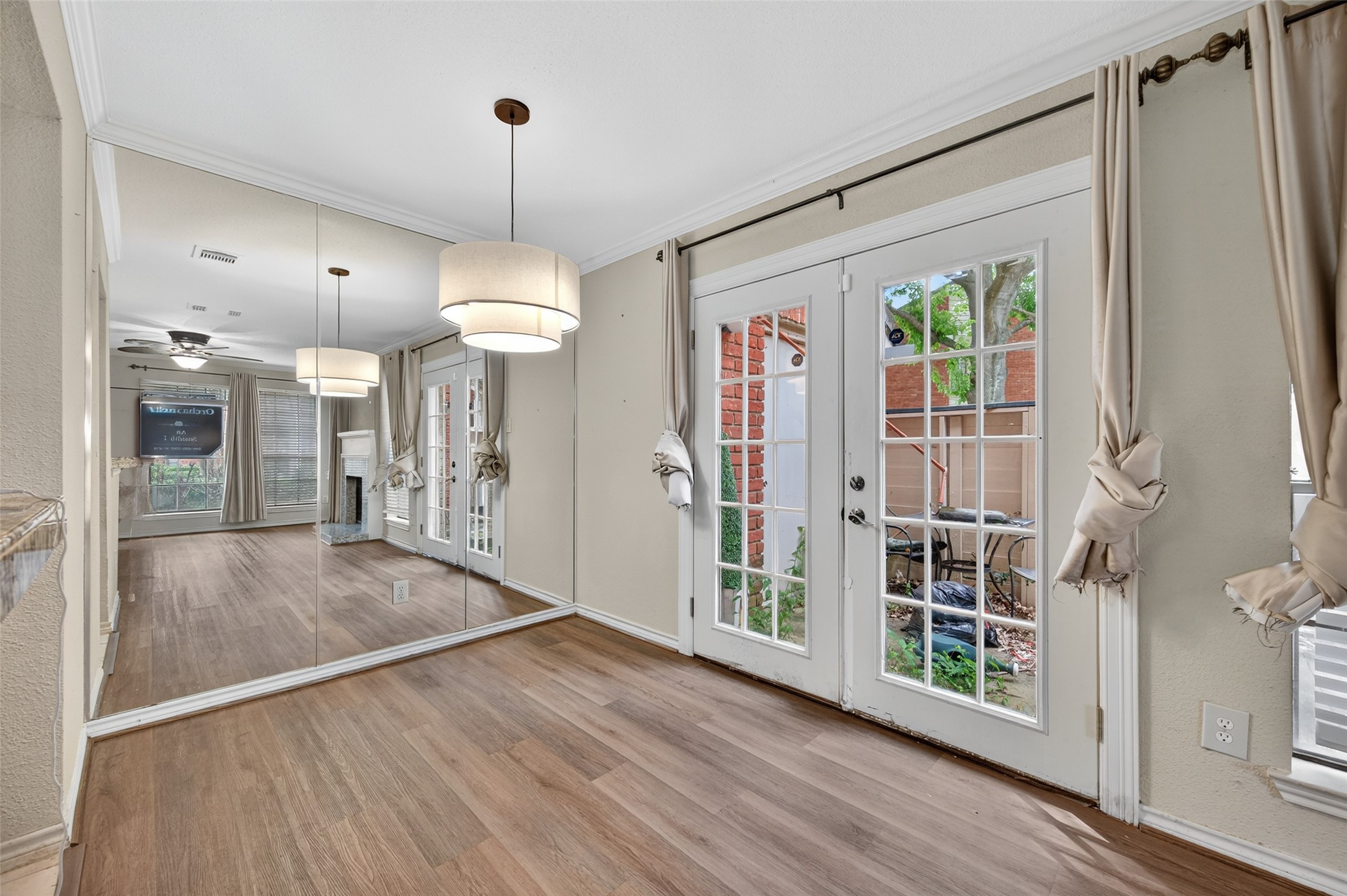 2211 South Kirkwood Road, Unit 49 Houston, TX 77077 - Photo 14 of 34 a view of a hallway with wooden floor and a chandelier