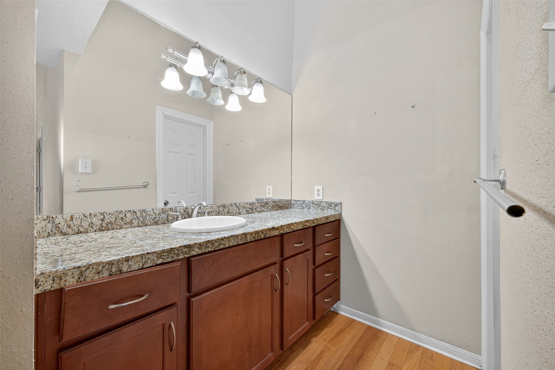 2211 South Kirkwood Road, Unit 49 Houston, TX 77077 - Photo 28 of 34 a bathroom with a granite countertop sink and a mirror
