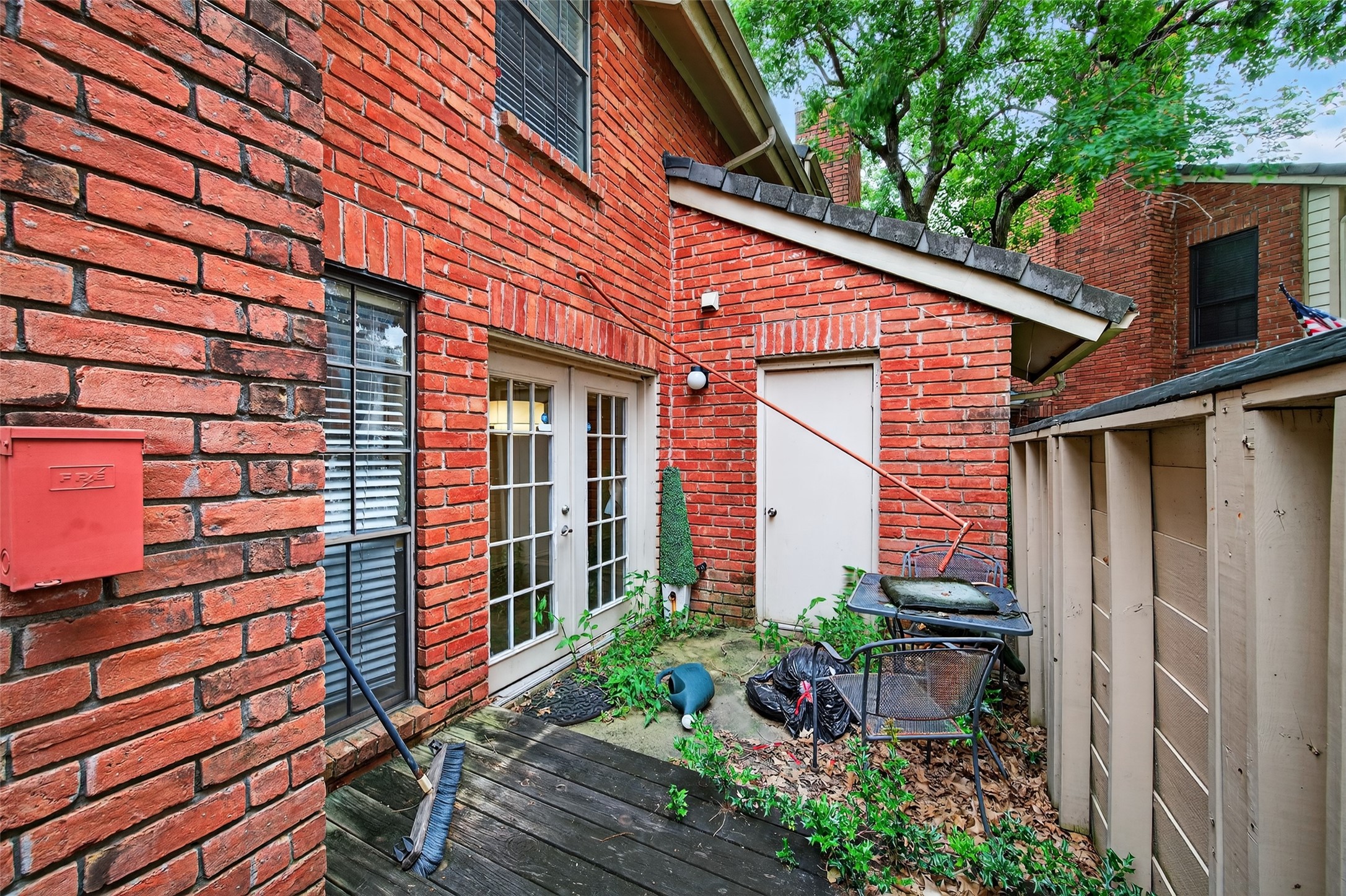 2211 South Kirkwood Road, Unit 49 Houston, TX 77077 - Photo 33 of 34 a view of a house with a yard and sitting area