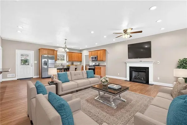 a living room with furniture fireplace and a flat screen tv