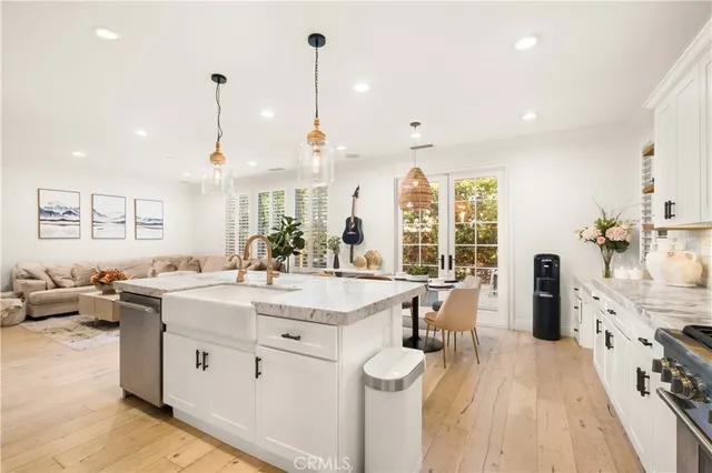 a open kitchen with stainless steel appliances granite countertop a sink and cabinets