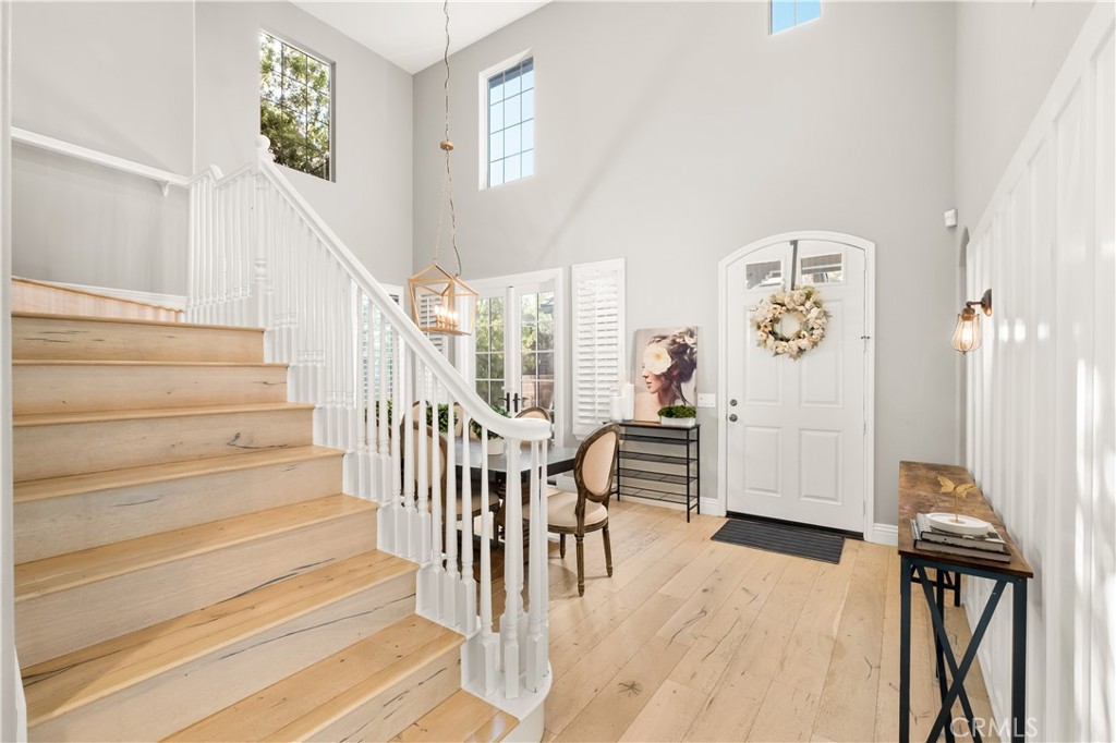 12 Ardennes Drive Ladera Ranch, CA 92694 - Photo 16 of 58 a view of a hallway with wooden floor and staircase