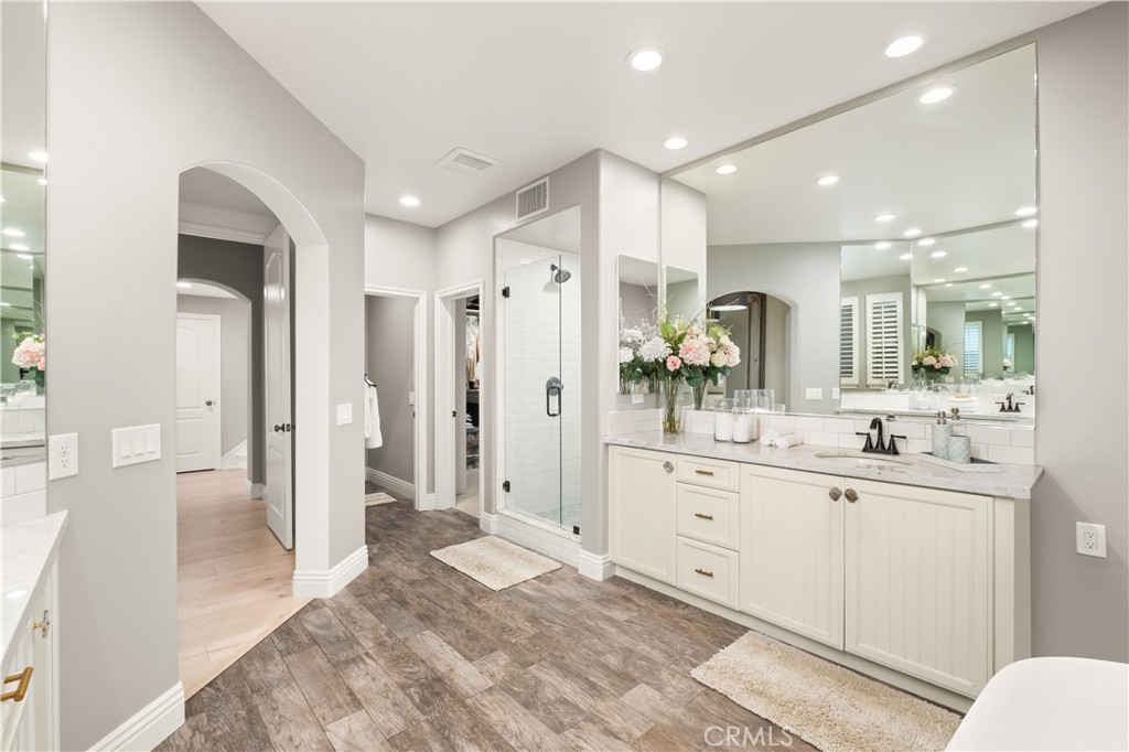 12 Ardennes Drive Ladera Ranch, CA 92694 - Photo 19 of 58 a large bathroom with a glass door shower sink and mirror