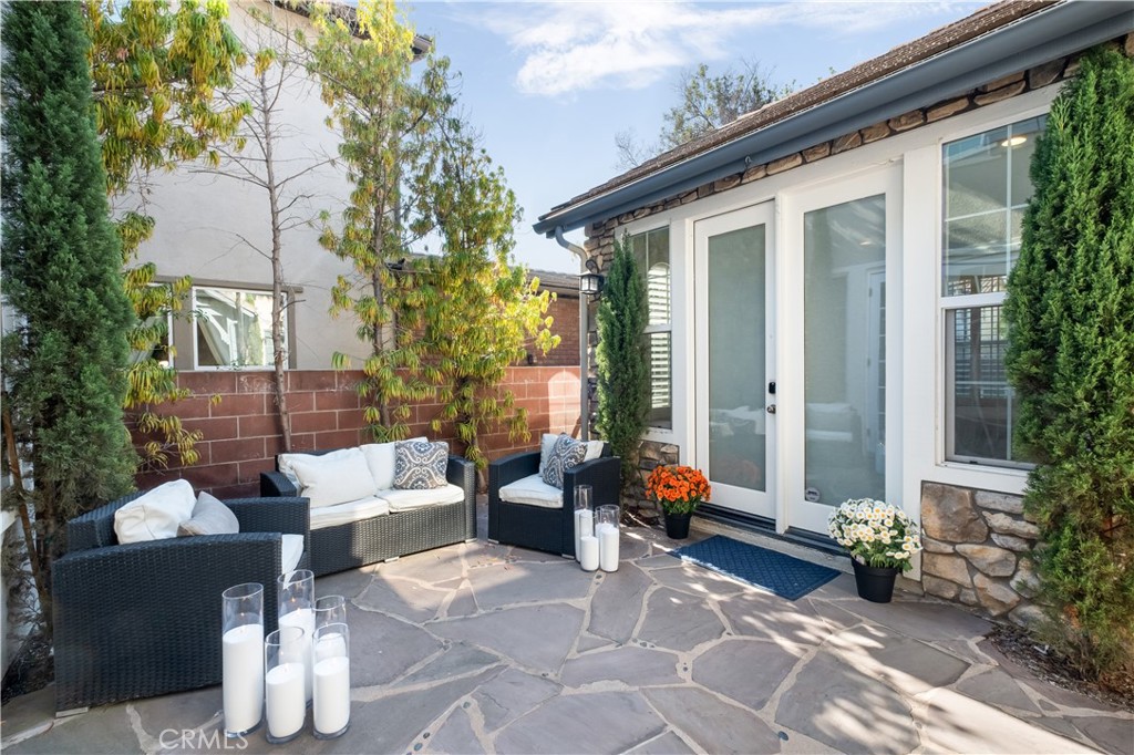 12 Ardennes Drive Ladera Ranch, CA 92694 - Photo 25 of 58 a view of a patio with couches table and chairs and potted plants