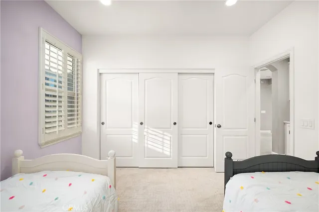 a view of a patio with table and chairs and potted plants
