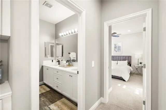 a view of a building with garden and sitting area