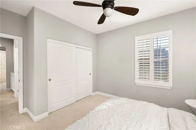 a view of a patio with table and chairs and potted plants