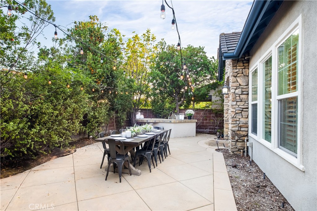 12 Ardennes Drive Ladera Ranch, CA 92694 - Photo 42 of 58 a view of a patio with table and chairs and potted plants