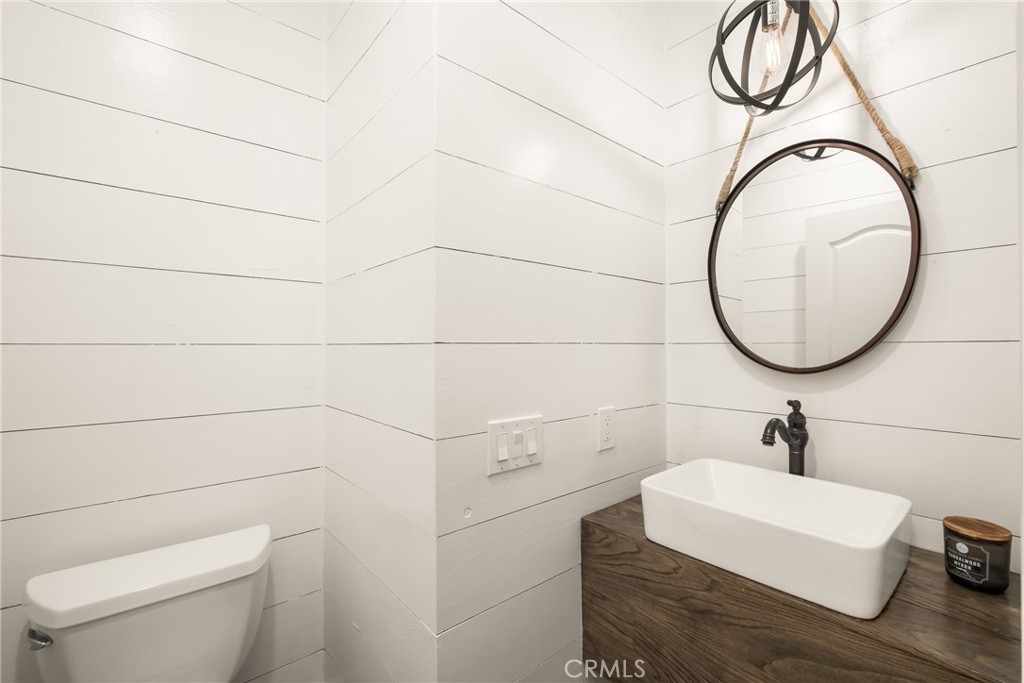 12 Ardennes Drive Ladera Ranch, CA 92694 - Photo 53 of 58 a bathroom with a sink a toilet and a mirror