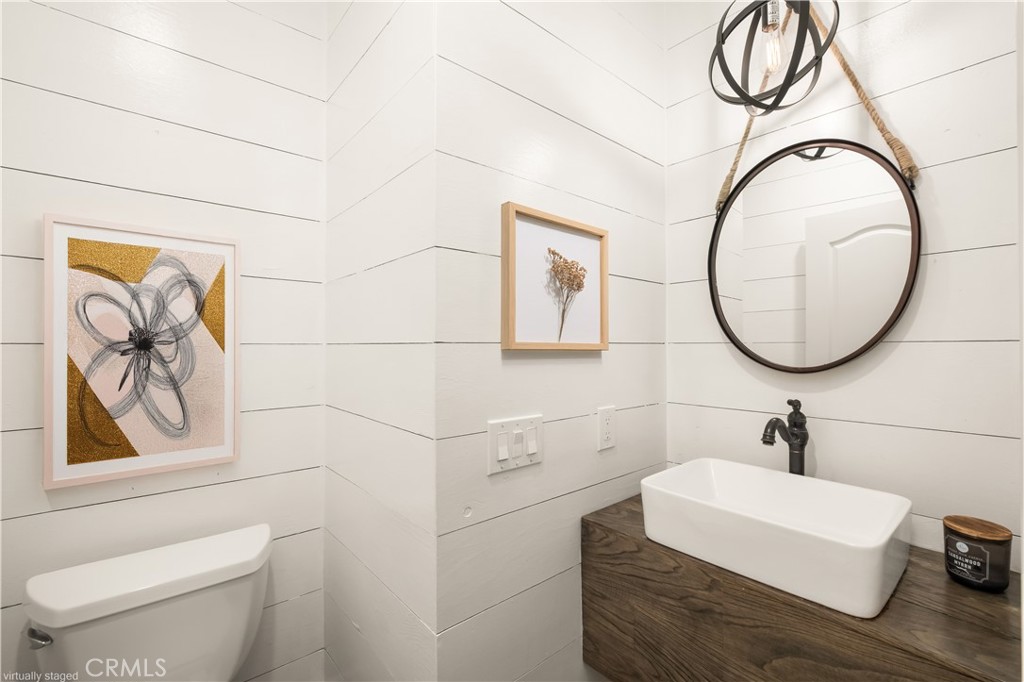 12 Ardennes Drive Ladera Ranch, CA 92694 - Photo 54 of 58 a bathroom with a sink a mirror and a toilet