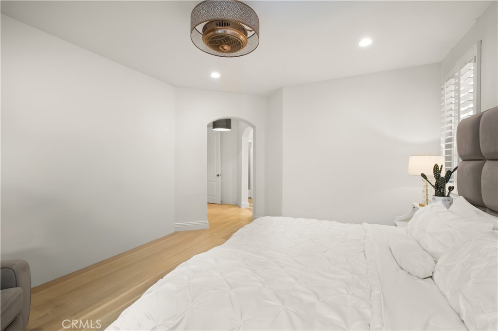 12 Ardennes Drive Ladera Ranch, CA 92694 - Photo 57 of 58 a bedroom with a bed and a chandelier