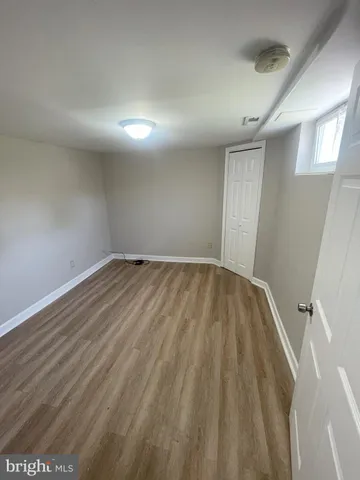 wooden floor in a hall with an entryway