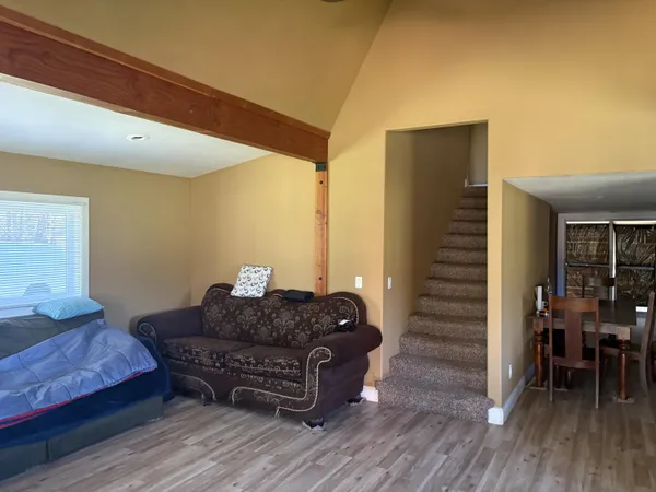 a bathroom with a shower curtain a sink and a toilet