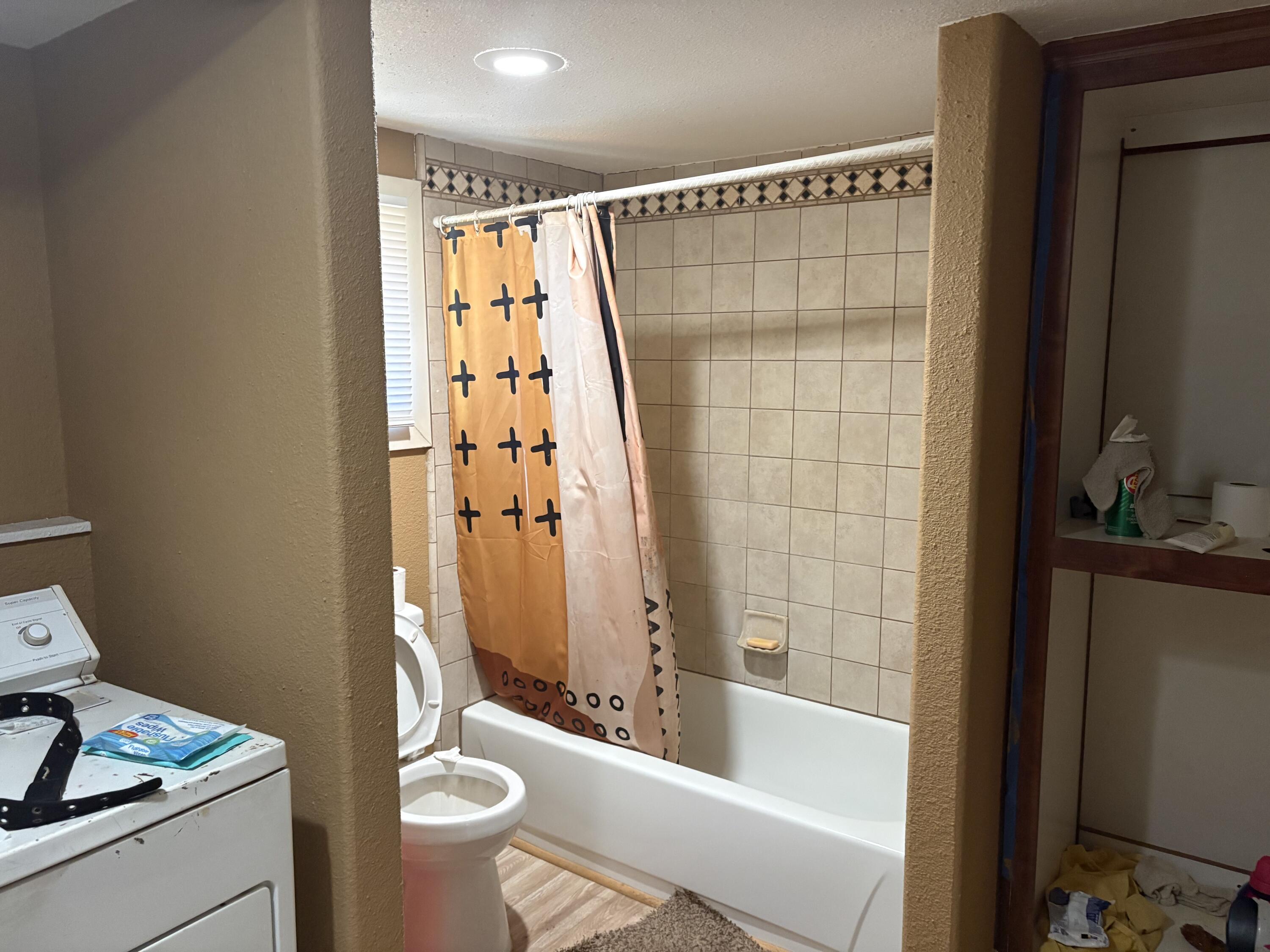 315 Schneider Ranch Road McArthur, CA 96056 - Photo 13 of 15 a bathroom with a shower curtain a sink and a toilet