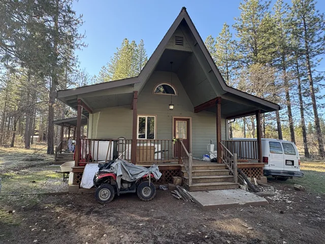 a view of a car park in front of house