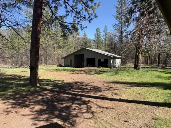 a kitchen with sink a stove and microwave