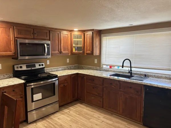 a kitchen with a refrigerator and a sink
