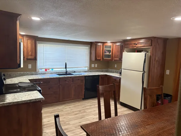 a view of dining room with furniture and wooden floor