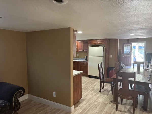 a view of a livingroom with furniture and windows
