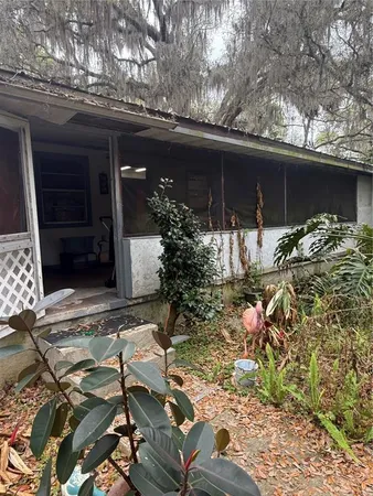 a view of house with yard