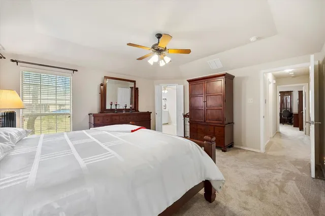 a bed room with a bed and a television