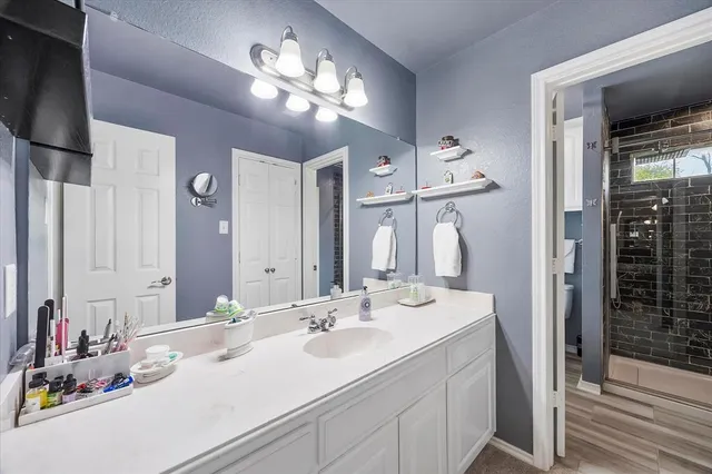 a bathroom with a sink double vanity and a mirror