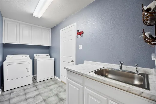 a dining room with furniture a rug and a large window