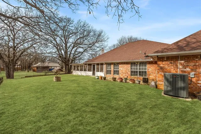 a view of green field with trees