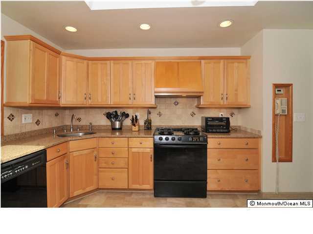 861 Colts Neck Road Freehold, NJ 07728 - Photo 1 of 25 a kitchen with stainless steel appliances granite countertop a stove a sink dishwasher and a refrigerator