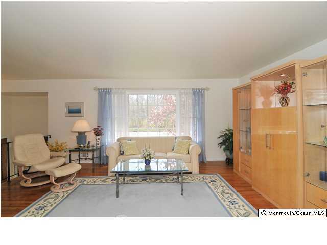861 Colts Neck Road Freehold, NJ 07728 - Photo 5 of 25 a living room with furniture and a window