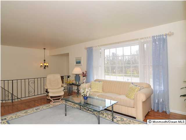 861 Colts Neck Road Freehold, NJ 07728 - Photo 6 of 25 a living room with furniture and a window
