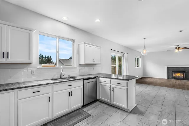 a kitchen with a sink stove and cabinets