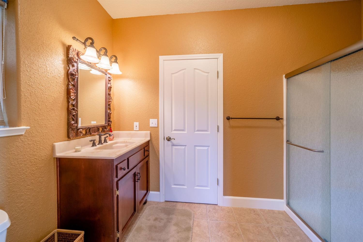 11545 Rocher Court Columbia, CA 95310 - Photo 14 of 49 a bathroom with a sink and a mirror