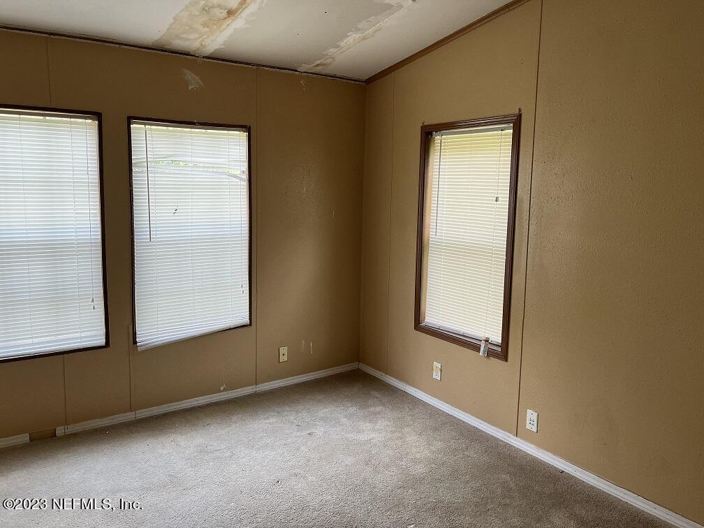 1370 Otis Road Jacksonville, FL 32220 - Photo 14 of 17 an empty room with windows