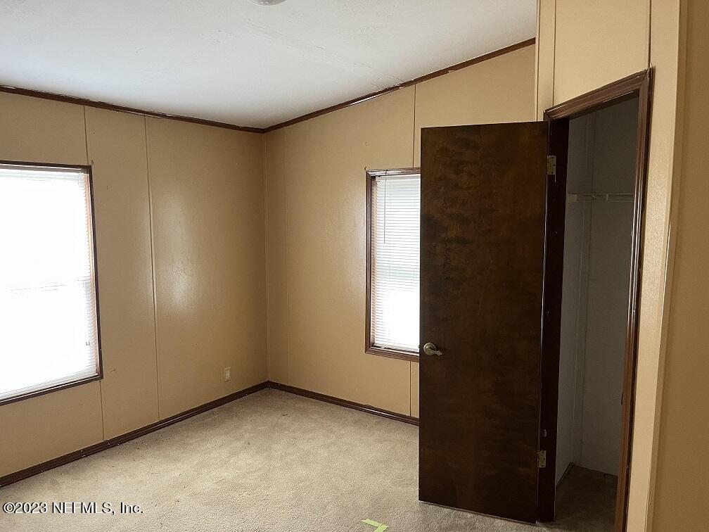 1370 Otis Road Jacksonville, FL 32220 - Photo 16 of 17 a view of an empty room with windows