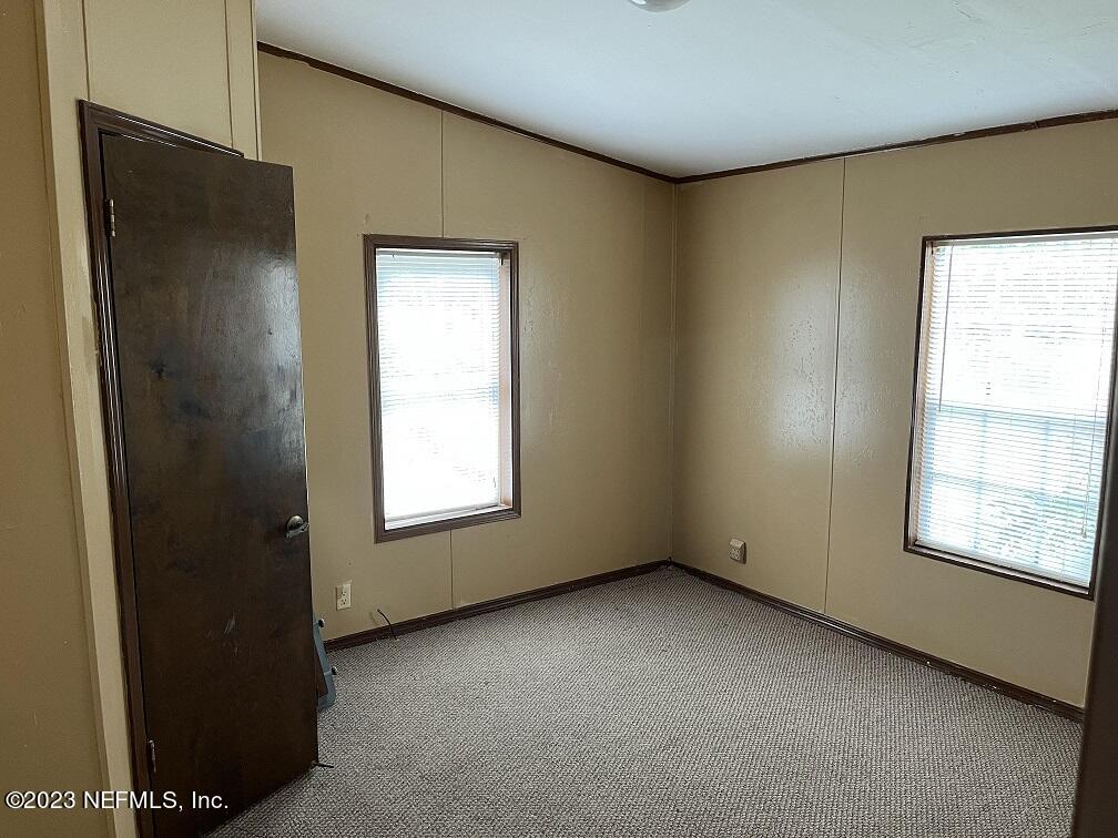 1370 Otis Road Jacksonville, FL 32220 - Photo 17 of 17 an empty room with a window