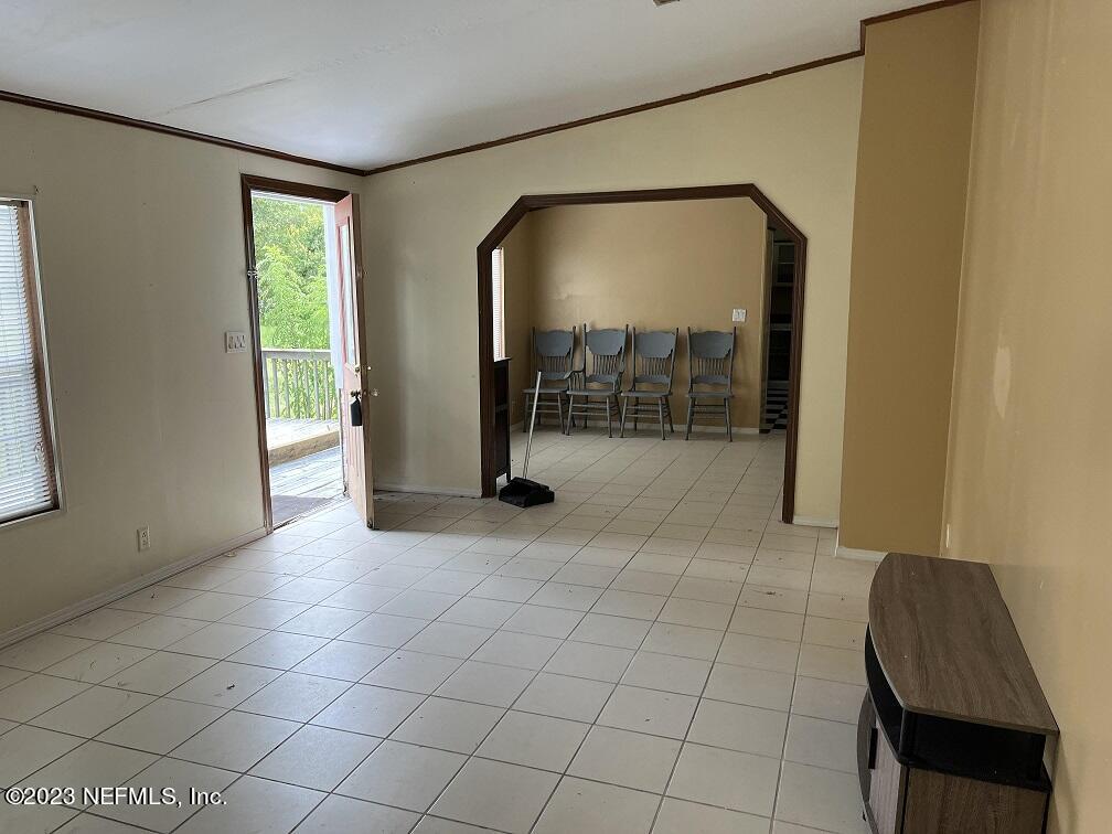 1370 Otis Road Jacksonville, FL 32220 - Photo 3 of 17 a view of a livingroom with furniture and window