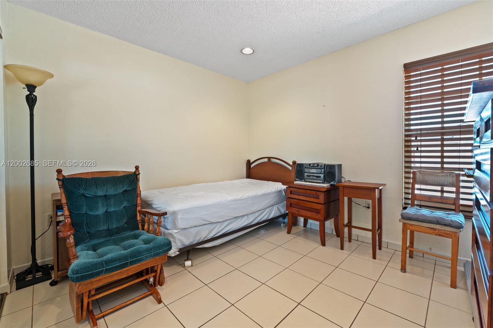 13440 Southwest 28th Street Miami, FL 33175 - Photo 17 of 35 a bedroom with furniture and a window