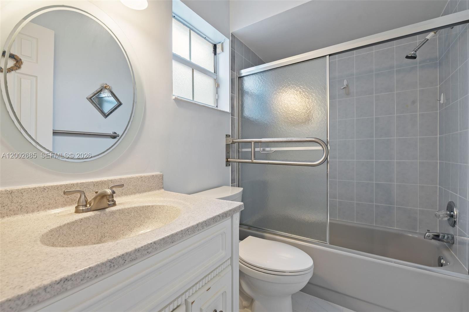 13440 Southwest 28th Street Miami, FL 33175 - Photo 20 of 35 a bathroom with a sink toilet and shower