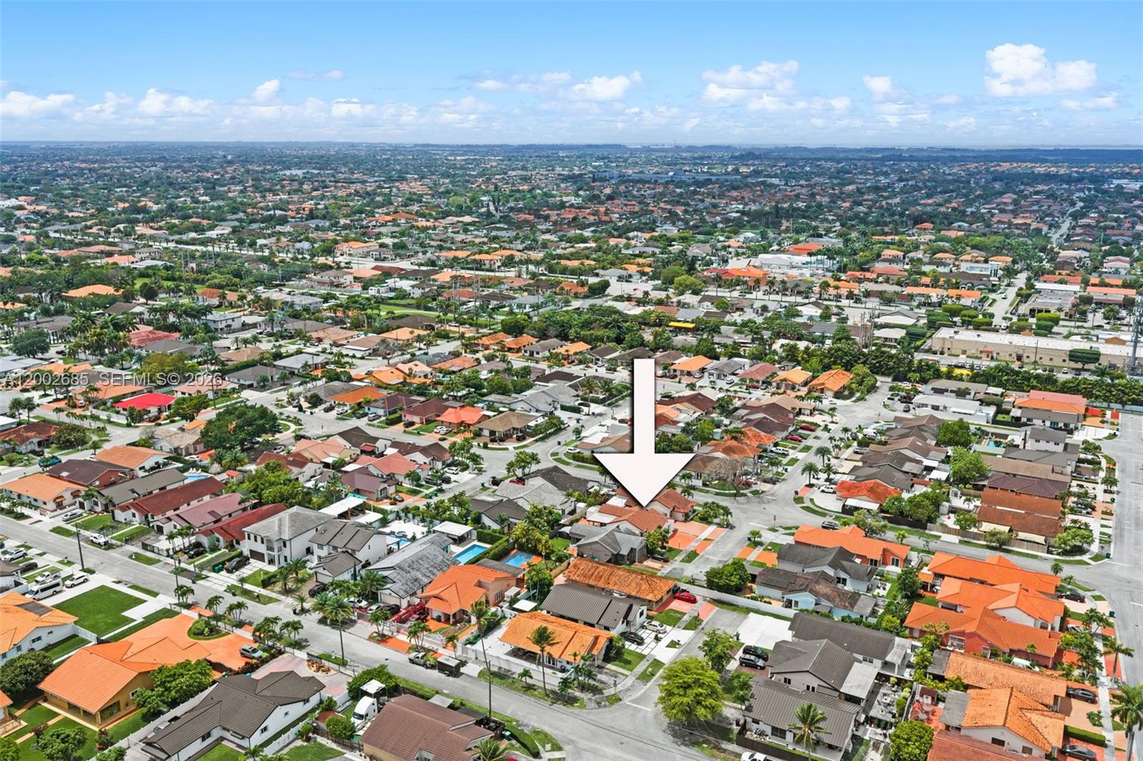 13440 Southwest 28th Street Miami, FL 33175 - Photo 32 of 35 an aerial view of residential houses with yard and outdoor seating
