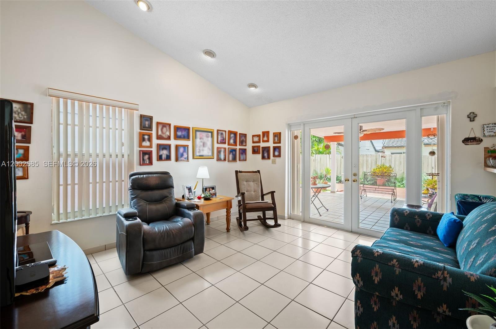 13440 Southwest 28th Street Miami, FL 33175 - Photo 6 of 35 a living room with furniture and large windows
