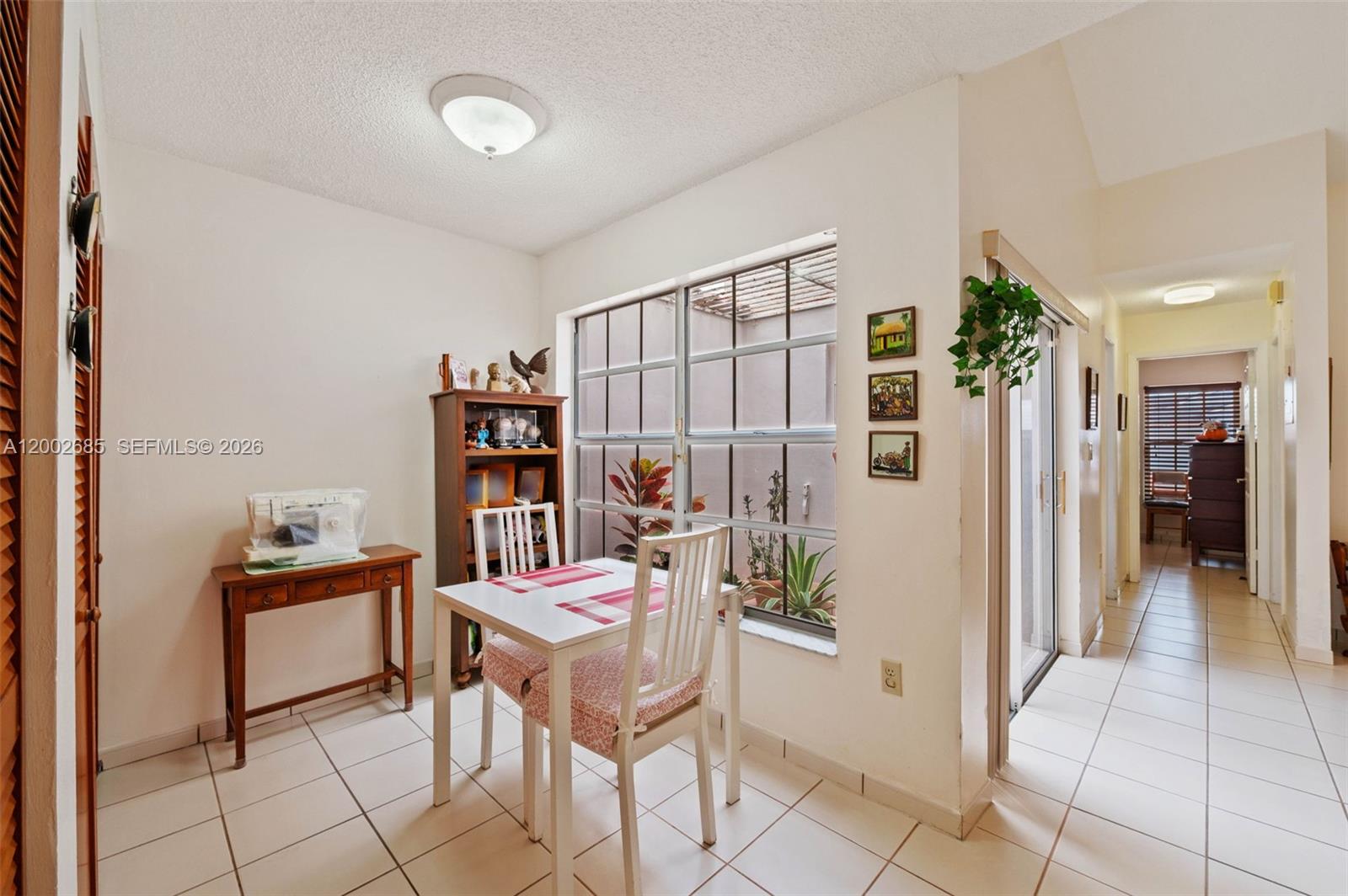 13440 Southwest 28th Street Miami, FL 33175 - Photo 8 of 35 a dining room with furniture and wooden floor