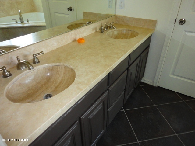 5 Valencia Lane Rio Rico, AZ 85648 - Photo 5 of 13 a bathroom with a sink and a mirror
